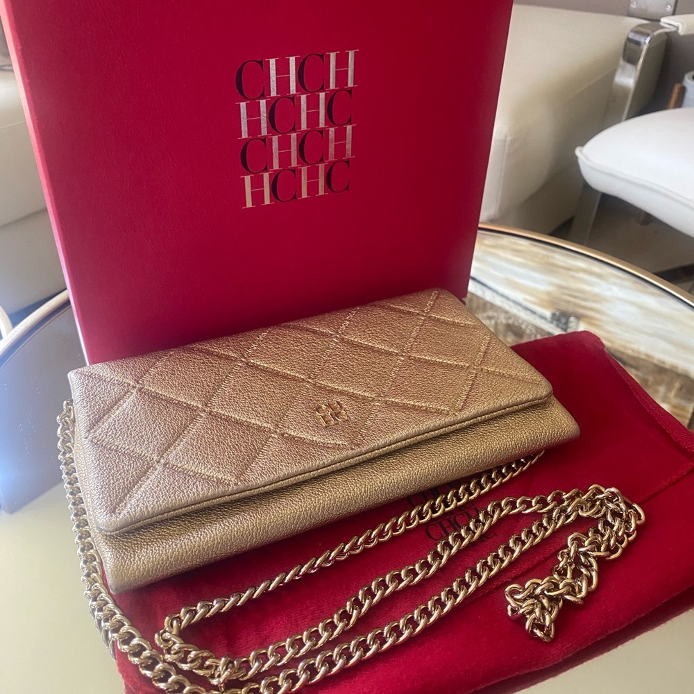 Carolina Herrera crossbody gold clutch